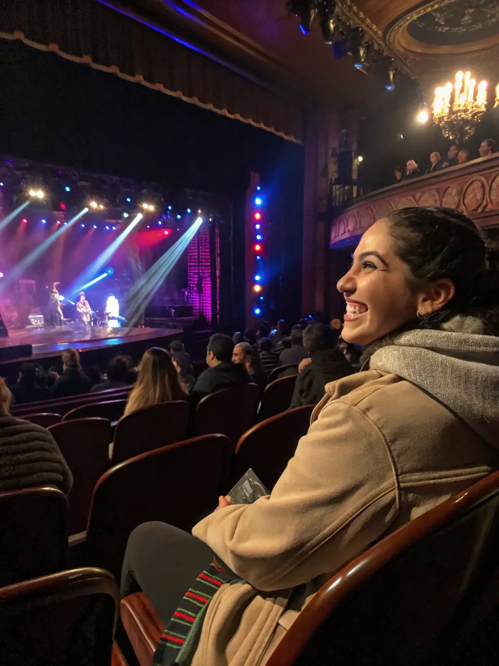 A photo of a diverse audience enjoying a performance organized by La Fabrique Imaginaire, highlighting the organization's role in promoting and disseminating artistic works.